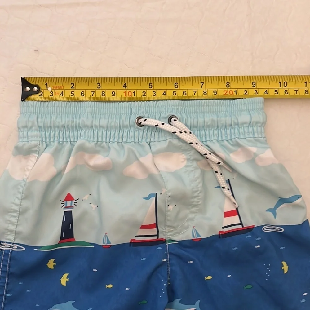 Carter’s sailboat print lined blue multicolor swim trunks